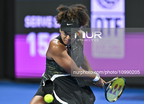 Naomi Osaka of Japan is playing in her first-round match against Caroline Garcia of France at the WTA 1000-Qatar TotalEnergies Open tennis t...