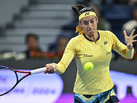 Caroline Garcia of France is in action during her first-round match against Naomi Osaka of Japan at the WTA 1000-Qatar TotalEnergies Open te...