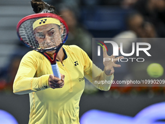 Caroline Garcia of France is in action during her first-round match against Naomi Osaka of Japan at the WTA 1000-Qatar TotalEnergies Open te...