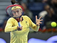 Caroline Garcia of France is in action during her first-round match against Naomi Osaka of Japan at the WTA 1000-Qatar TotalEnergies Open te...