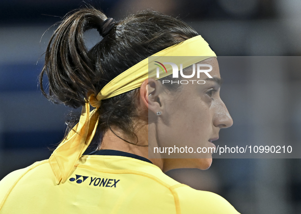 Caroline Garcia of France is reacting during her first-round match against Naomi Osaka of Japan at the WTA 1000-Qatar TotalEnergies Open ten...