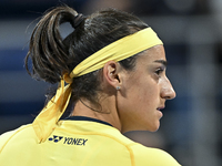 Caroline Garcia of France is reacting during her first-round match against Naomi Osaka of Japan at the WTA 1000-Qatar TotalEnergies Open ten...