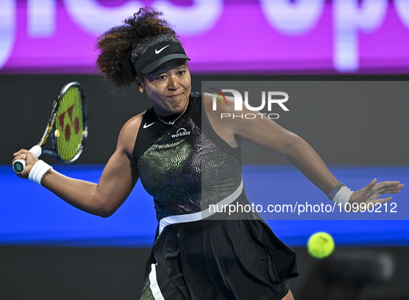 Naomi Osaka of Japan is playing in her first-round match against Caroline Garcia of France at the WTA 1000-Qatar TotalEnergies Open tennis t...