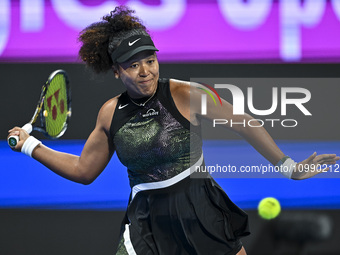 Naomi Osaka of Japan is playing in her first-round match against Caroline Garcia of France at the WTA 1000-Qatar TotalEnergies Open tennis t...