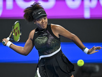 Naomi Osaka of Japan is playing in her first-round match against Caroline Garcia of France at the WTA 1000-Qatar TotalEnergies Open tennis t...