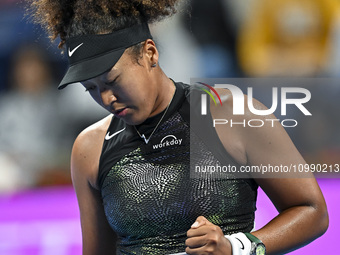 Naomi Osaka of Japan is reacting during her first-round match against Caroline Garcia of France at the WTA 1000-Qatar TotalEnergies Open ten...