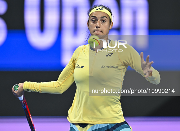 Caroline Garcia of France is in action during her first-round match against Naomi Osaka of Japan at the WTA 1000-Qatar TotalEnergies Open te...