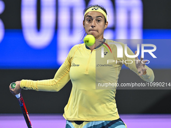 Caroline Garcia of France is in action during her first-round match against Naomi Osaka of Japan at the WTA 1000-Qatar TotalEnergies Open te...