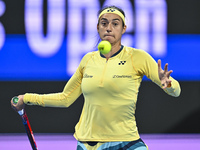 Caroline Garcia of France is in action during her first-round match against Naomi Osaka of Japan at the WTA 1000-Qatar TotalEnergies Open te...