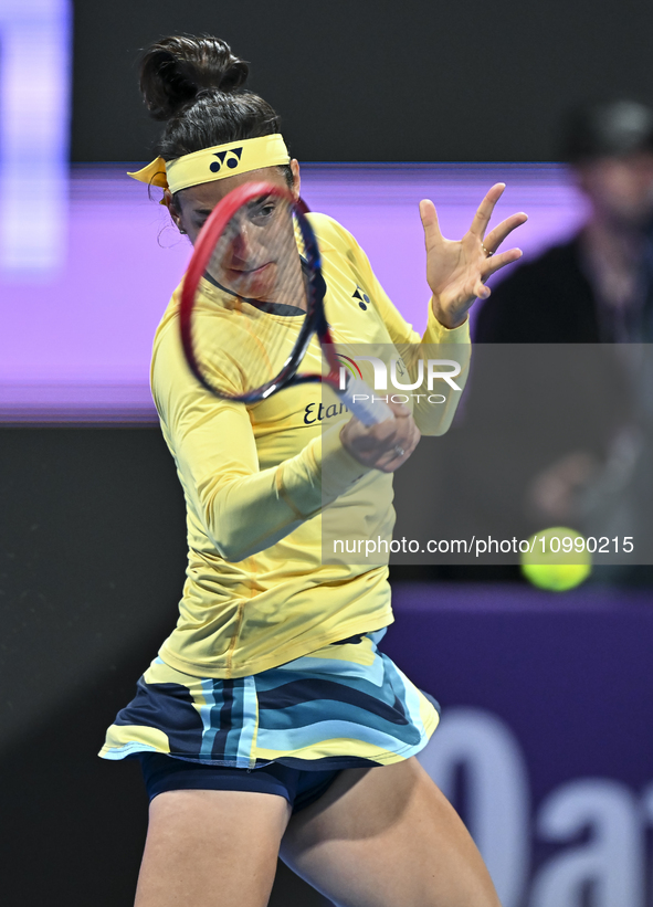 Caroline Garcia of France is in action during her first-round match against Naomi Osaka of Japan at the WTA 1000-Qatar TotalEnergies Open te...