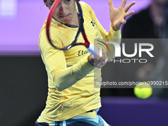 Caroline Garcia of France is in action during her first-round match against Naomi Osaka of Japan at the WTA 1000-Qatar TotalEnergies Open te...