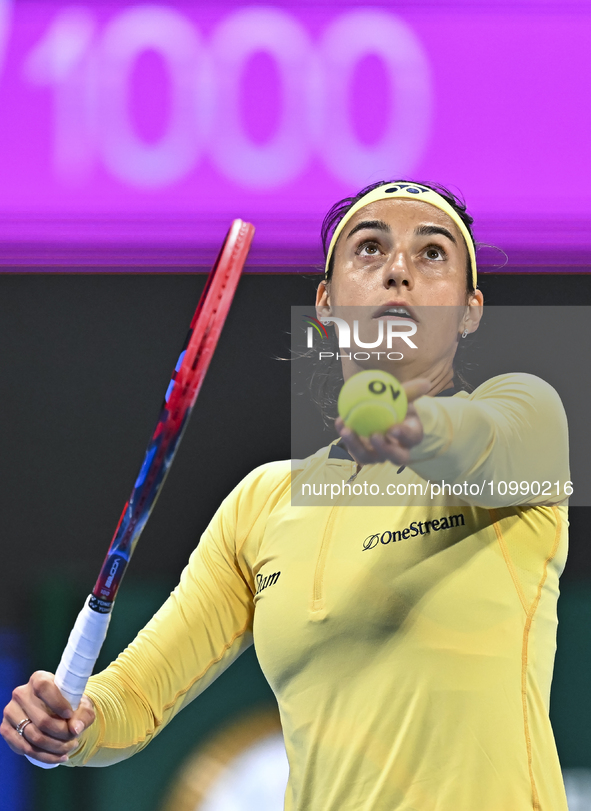 Caroline Garcia of France is in action during her first-round match against Naomi Osaka of Japan at the WTA 1000-Qatar TotalEnergies Open te...