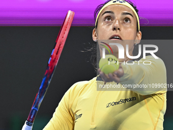 Caroline Garcia of France is in action during her first-round match against Naomi Osaka of Japan at the WTA 1000-Qatar TotalEnergies Open te...