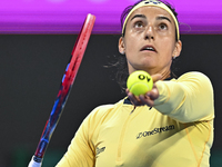 Caroline Garcia of France is in action during her first-round match against Naomi Osaka of Japan at the WTA 1000-Qatar TotalEnergies Open te...