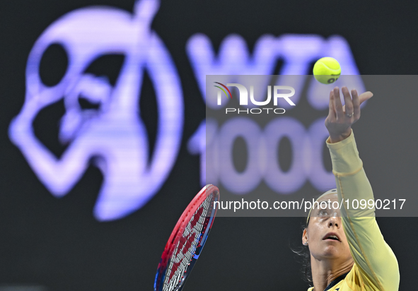 Caroline Garcia of France is in action during her first-round match against Naomi Osaka of Japan at the WTA 1000-Qatar TotalEnergies Open te...