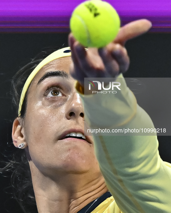 Caroline Garcia of France is in action during her first-round match against Naomi Osaka of Japan at the WTA 1000-Qatar TotalEnergies Open te...