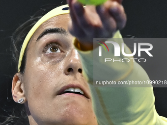 Caroline Garcia of France is in action during her first-round match against Naomi Osaka of Japan at the WTA 1000-Qatar TotalEnergies Open te...