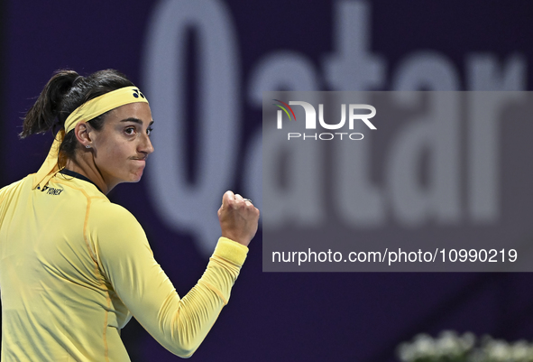 Caroline Garcia of France is reacting during her first-round match against Naomi Osaka of Japan at the WTA 1000-Qatar TotalEnergies Open ten...