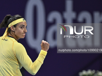 Caroline Garcia of France is reacting during her first-round match against Naomi Osaka of Japan at the WTA 1000-Qatar TotalEnergies Open ten...