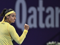 Caroline Garcia of France is reacting during her first-round match against Naomi Osaka of Japan at the WTA 1000-Qatar TotalEnergies Open ten...