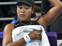 Naomi Osaka of Japan is reacting during her first-round match against Caroline Garcia of France at the WTA 1000-Qatar TotalEnergies Open ten...