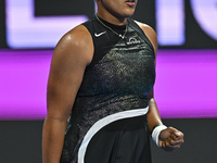 Naomi Osaka of Japan is reacting during her first-round match against Caroline Garcia of France at the WTA 1000-Qatar TotalEnergies Open ten...