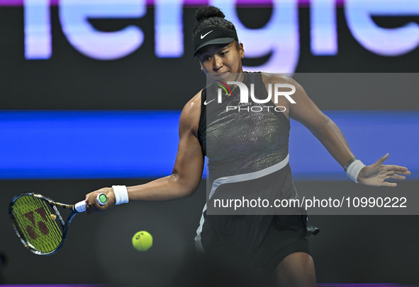 Naomi Osaka of Japan is playing in her first-round match against Caroline Garcia of France at the WTA 1000-Qatar TotalEnergies Open tennis t...