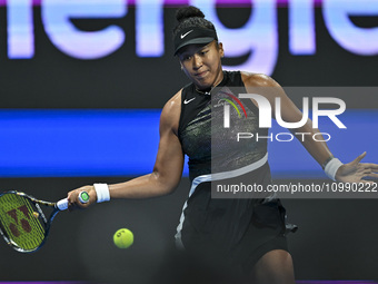 Naomi Osaka of Japan is playing in her first-round match against Caroline Garcia of France at the WTA 1000-Qatar TotalEnergies Open tennis t...