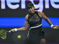 Naomi Osaka of Japan is playing in her first-round match against Caroline Garcia of France at the WTA 1000-Qatar TotalEnergies Open tennis t...