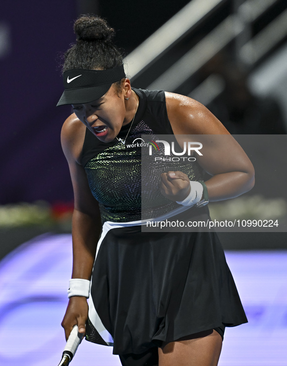 Naomi Osaka of Japan is reacting during her first-round match against Caroline Garcia of France at the WTA 1000-Qatar TotalEnergies Open ten...