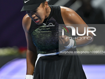 Naomi Osaka of Japan is reacting during her first-round match against Caroline Garcia of France at the WTA 1000-Qatar TotalEnergies Open ten...