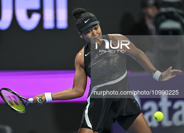 Naomi Osaka of Japan is playing in her first-round match against Caroline Garcia of France at the WTA 1000-Qatar TotalEnergies Open tennis t...