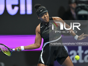 Naomi Osaka of Japan is playing in her first-round match against Caroline Garcia of France at the WTA 1000-Qatar TotalEnergies Open tennis t...