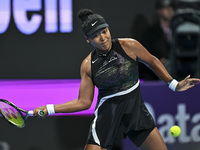 Naomi Osaka of Japan is playing in her first-round match against Caroline Garcia of France at the WTA 1000-Qatar TotalEnergies Open tennis t...