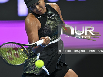 Naomi Osaka of Japan is playing in her first-round match against Caroline Garcia of France at the WTA 1000-Qatar TotalEnergies Open tennis t...