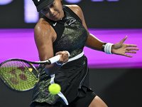 Naomi Osaka of Japan is playing in her first-round match against Caroline Garcia of France at the WTA 1000-Qatar TotalEnergies Open tennis t...