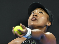 Naomi Osaka of Japan is playing in her first-round match against Caroline Garcia of France at the WTA 1000-Qatar TotalEnergies Open tennis t...