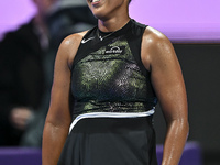 Naomi Osaka of Japan is reacting during her first-round match against Caroline Garcia of France at the WTA 1000-Qatar TotalEnergies Open ten...