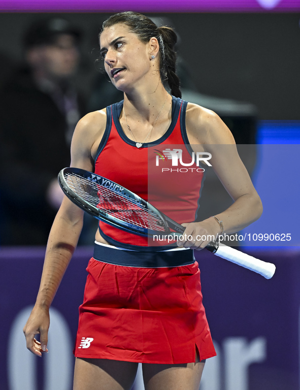 Sorana Cirstea of Romania is reacting during her second-round match against Iga Swiatek of Poland at the WTA 1000-Qatar TotalEnergies Open t...