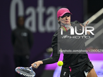 Iga Swiatek of Poland is playing in her second-round match against Sorana Cirstea of Romania at the WTA 1000-Qatar TotalEnergies Open tennis...