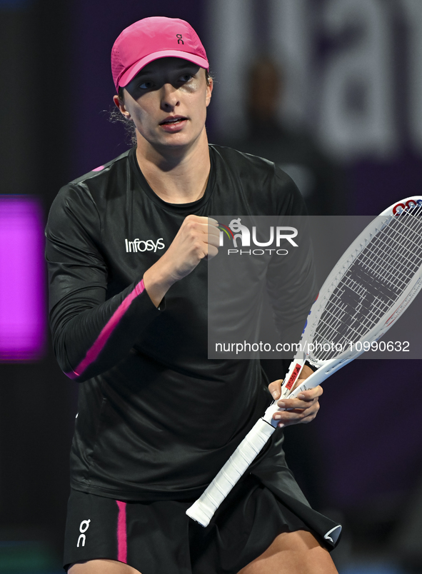 Iga Swiatek of Poland is reacting during her second-round match against Sorana Cirstea of Romania at the WTA 1000-Qatar TotalEnergies Open t...