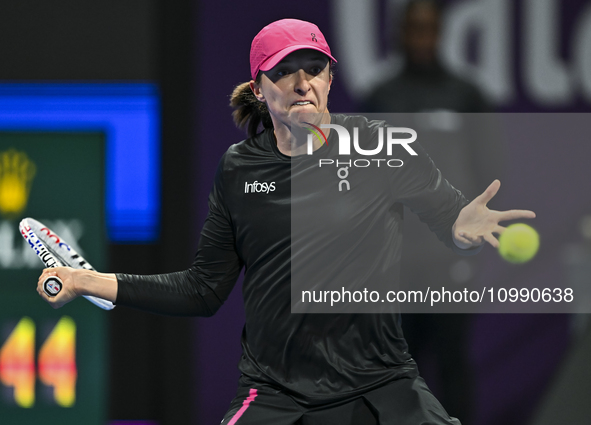 Iga Swiatek of Poland is playing in her second-round match against Sorana Cirstea of Romania at the WTA 1000-Qatar TotalEnergies Open tennis...