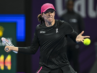 Iga Swiatek of Poland is playing in her second-round match against Sorana Cirstea of Romania at the WTA 1000-Qatar TotalEnergies Open tennis...