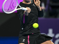 Iga Swiatek of Poland is playing in her second-round match against Sorana Cirstea of Romania at the WTA 1000-Qatar TotalEnergies Open tennis...