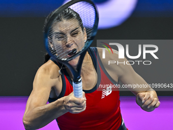 Sorana Cirstea of Romania is playing in her second-round match against Iga Swiatek of Poland at the WTA 1000-Qatar TotalEnergies Open tennis...