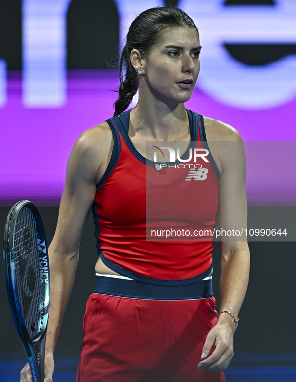 Sorana Cirstea of Romania is reacting during her second-round match against Iga Swiatek of Poland at the WTA 1000-Qatar TotalEnergies Open t...