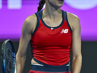 Sorana Cirstea of Romania is reacting during her second-round match against Iga Swiatek of Poland at the WTA 1000-Qatar TotalEnergies Open t...