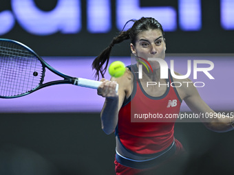 Sorana Cirstea of Romania is playing in her second-round match against Iga Swiatek of Poland at the WTA 1000-Qatar TotalEnergies Open tennis...