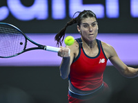 Sorana Cirstea of Romania is playing in her second-round match against Iga Swiatek of Poland at the WTA 1000-Qatar TotalEnergies Open tennis...