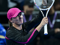 Iga Swiatek of Poland is celebrating after winning her second-round match against Sorana Cirstea of Romania at the WTA 1000-Qatar TotalEnerg...